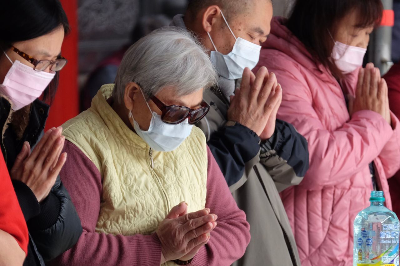 Taiwanese devotees at a temple in Taipei on January 28, 2020.