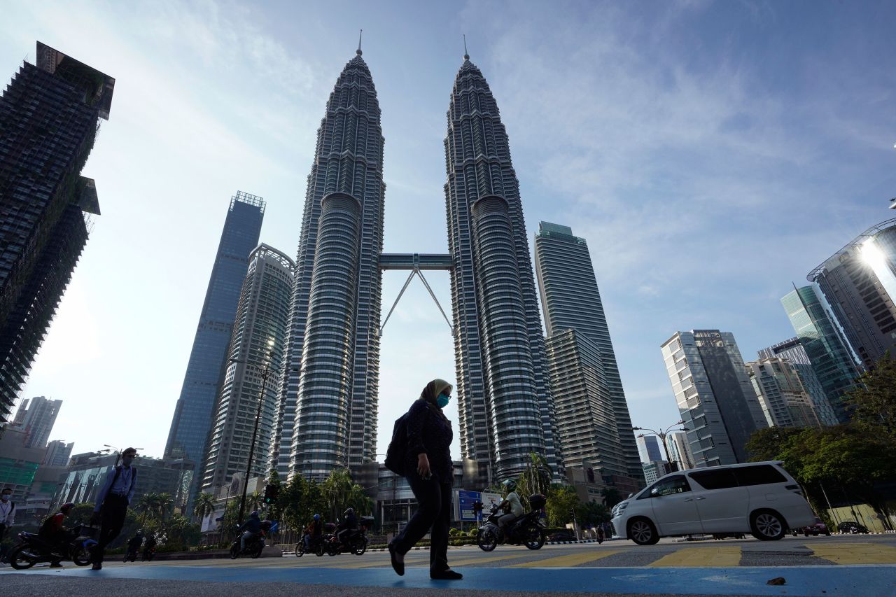 Pedestrians walk through Kuala Lumpur, Malaysia on Wednesday.?