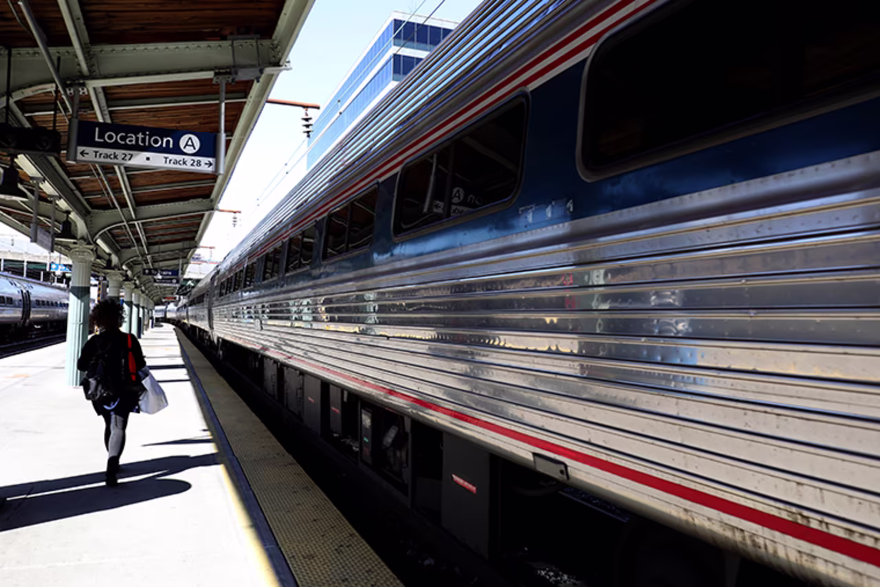 A passenger walks to a departing Amtrak train at Union Station on April 09, 2020 in Washington, D.C. 
