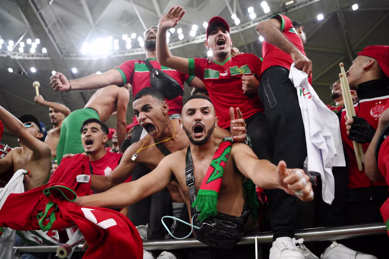 Morocco fans celebrate the team's victory over Portugal on Saturday, December 10. 