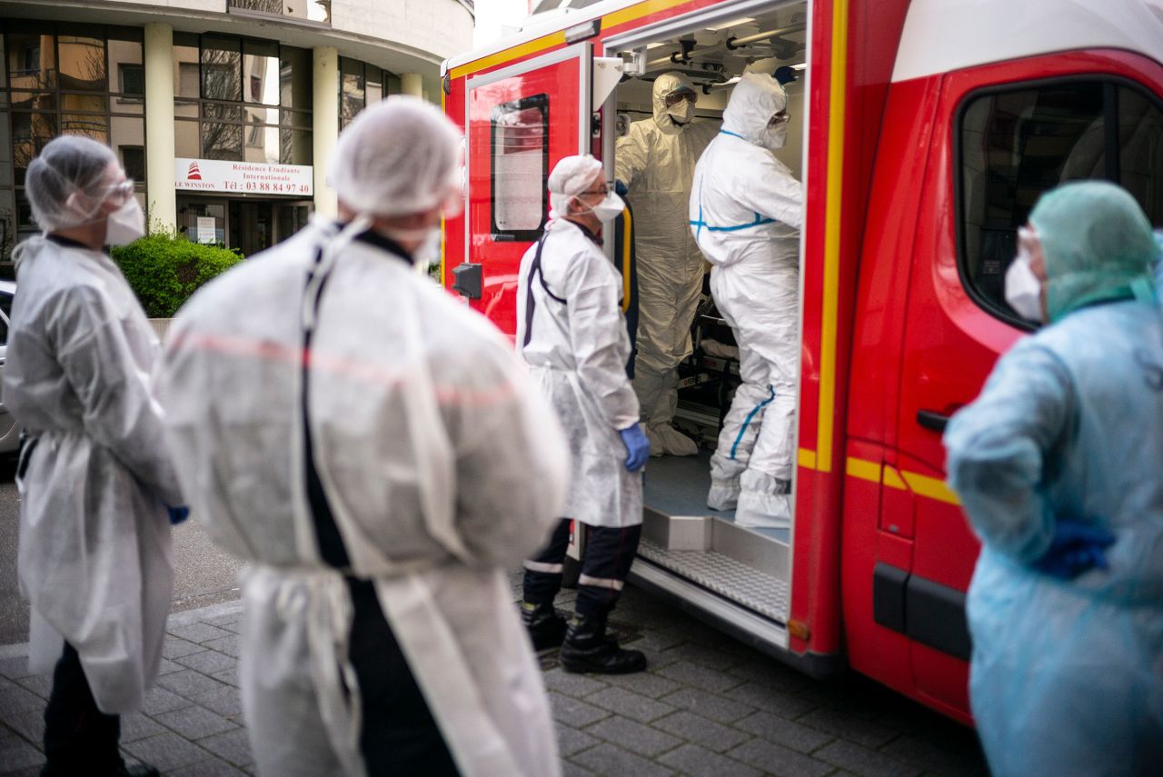Rescue workers take care of a man in Strasburg, France, on Monday, March 16.