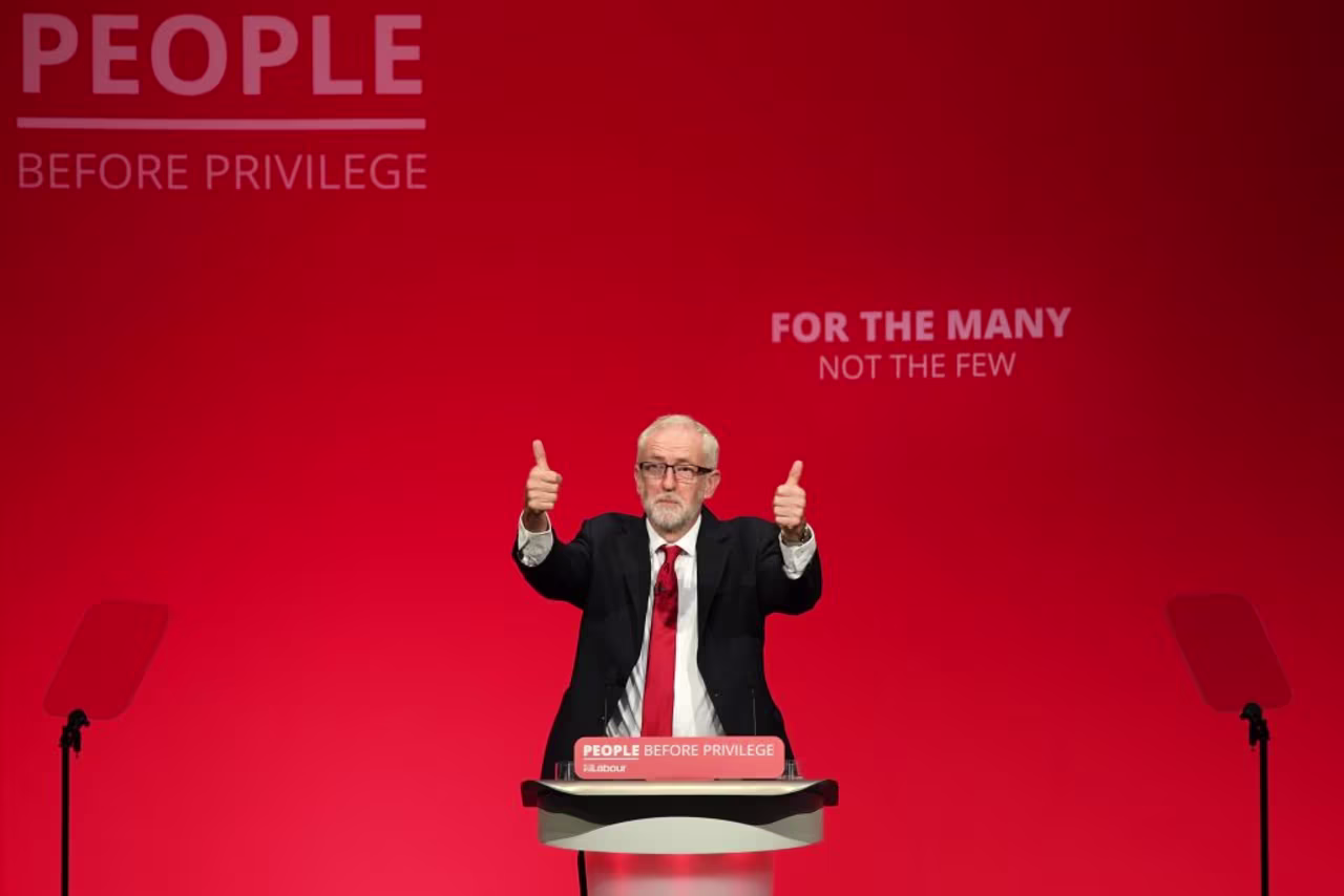 Jeremy Corbyn acknowledges applause at the start of his speech.