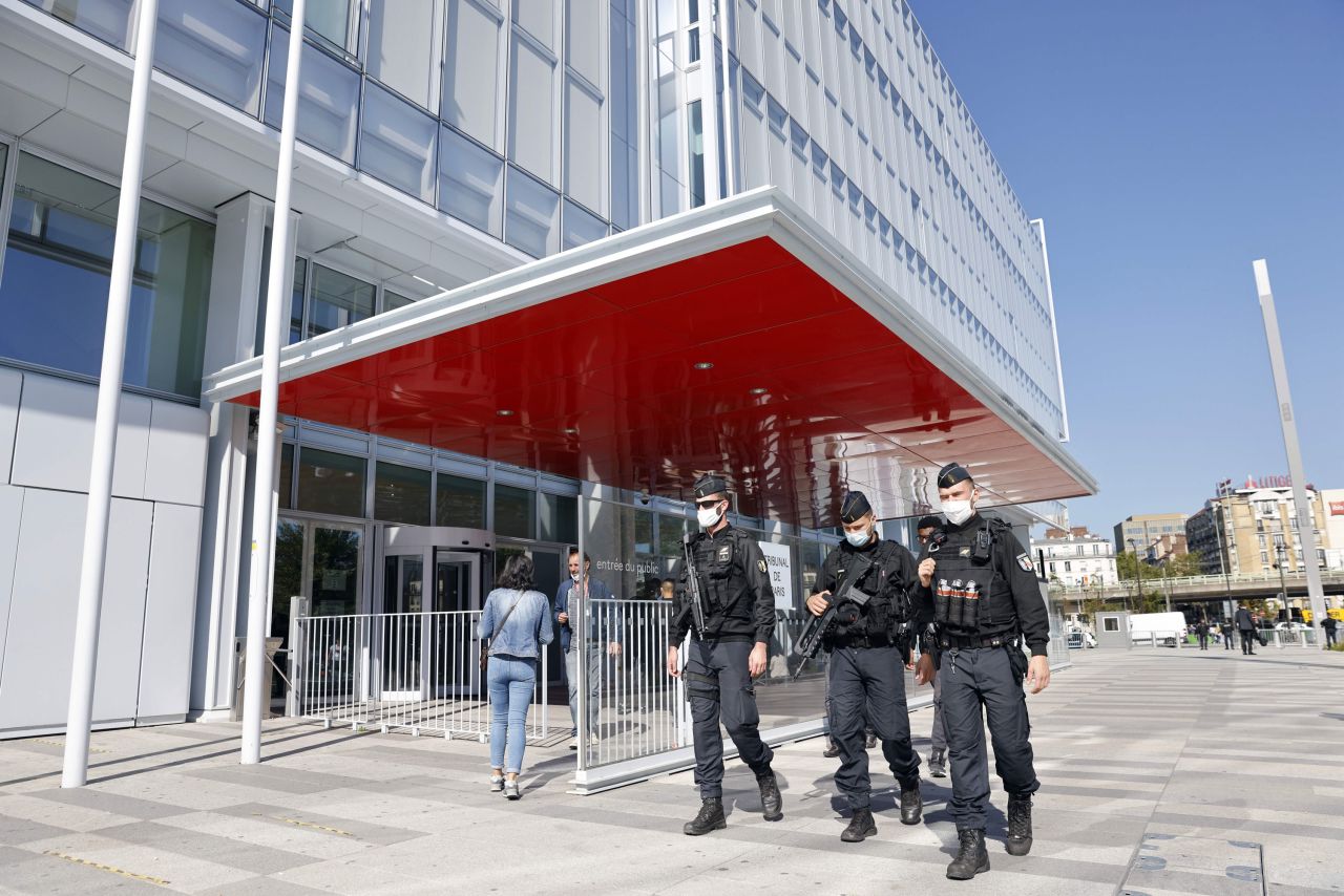 Police officers patrol outside Paris' courthouse, on September 2, the opening day of the trial of 14 suspected accomplices in the Charlie Hebdo attack.