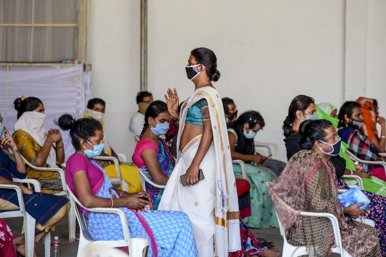 Transgender activist Chandramukhi Muvvala, center, gives instructions to transgender people as they wait for free food distribution during a government-imposed nationwide lockdown in Hyderabad, India, on April 29.