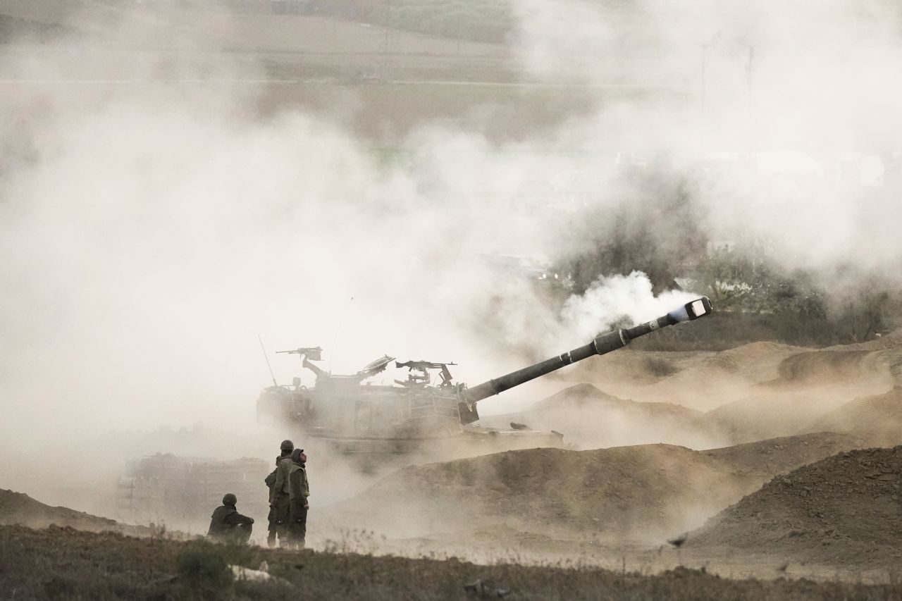 An Israeli mobile artillery unit fires a shell from southern Israel towards Gaza, in a position near the Israel-Gaza border, on October 25.