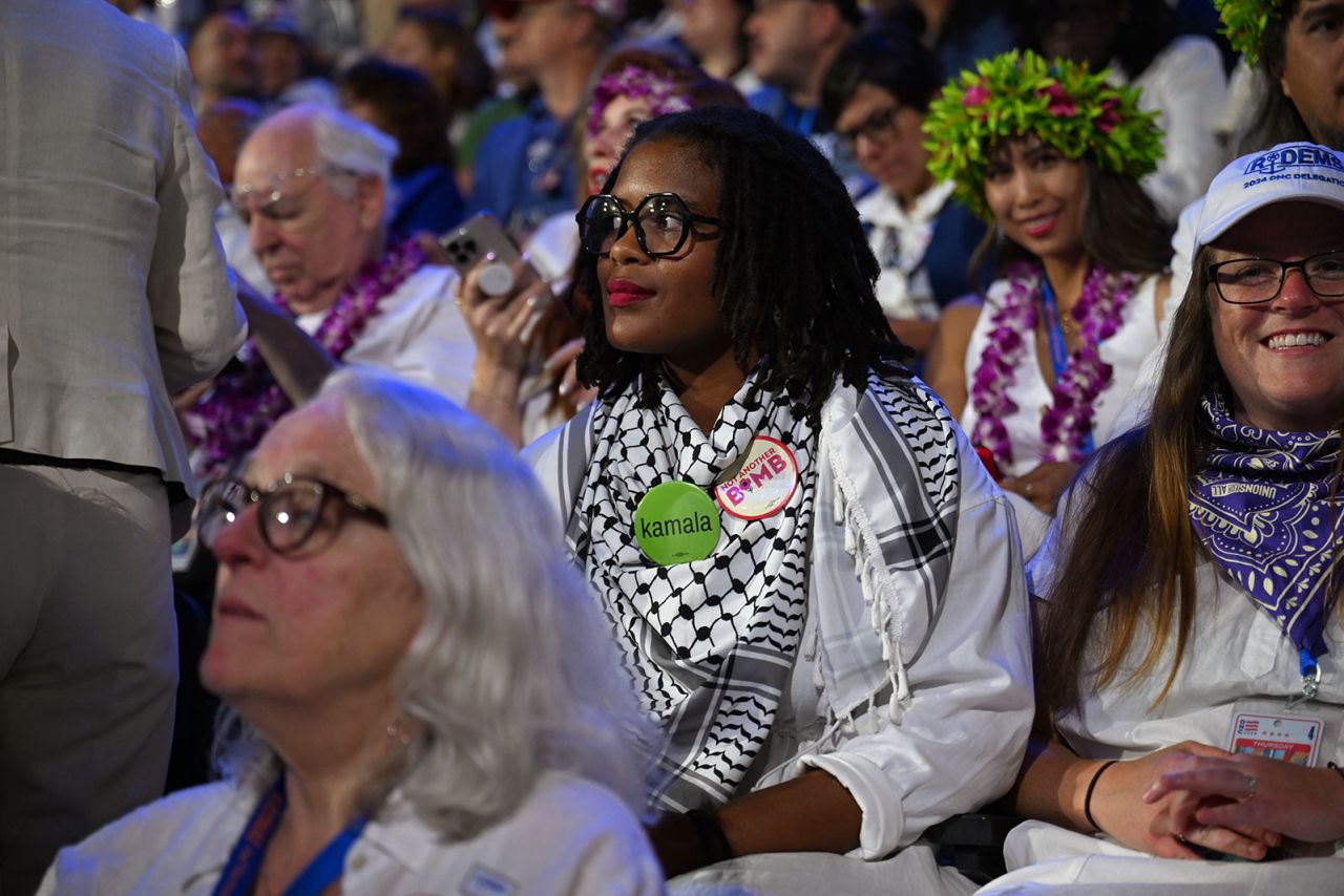 Several attendees are wearing white during the DNC on Thursday, August 22, in Chicago.