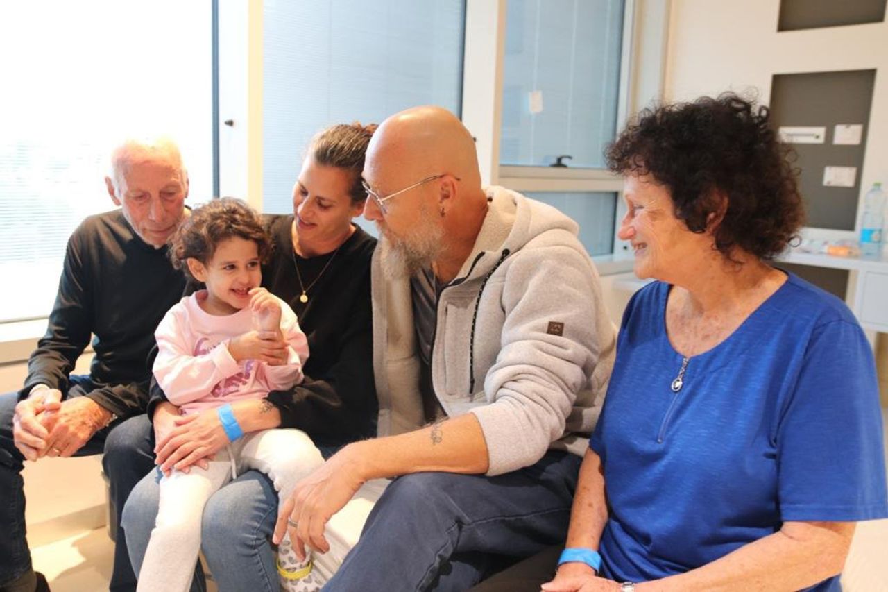 Abigail Edan, second from left, is surrounded by family at Schneider Children's Medical Center on November 27 in Petah Tikva, Israel.