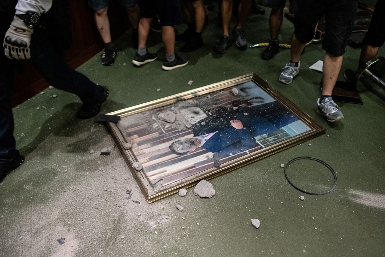 The portrait of Andrew Leung, the chairman of the Legislative Council, is destroyed after protesters broke into the parliament chamber of the government headquarters in Hong Kong on July 1, 2019. 