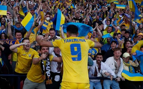 Ukraine's Roman Yaremchuk celebrates after scoring their second goal with fans. 