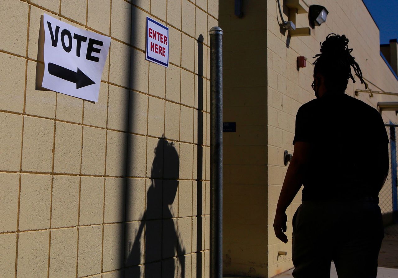 A woman enters a voting station on Election Day at Robert E. Lake Elementary School November 3, in Las Vegas.