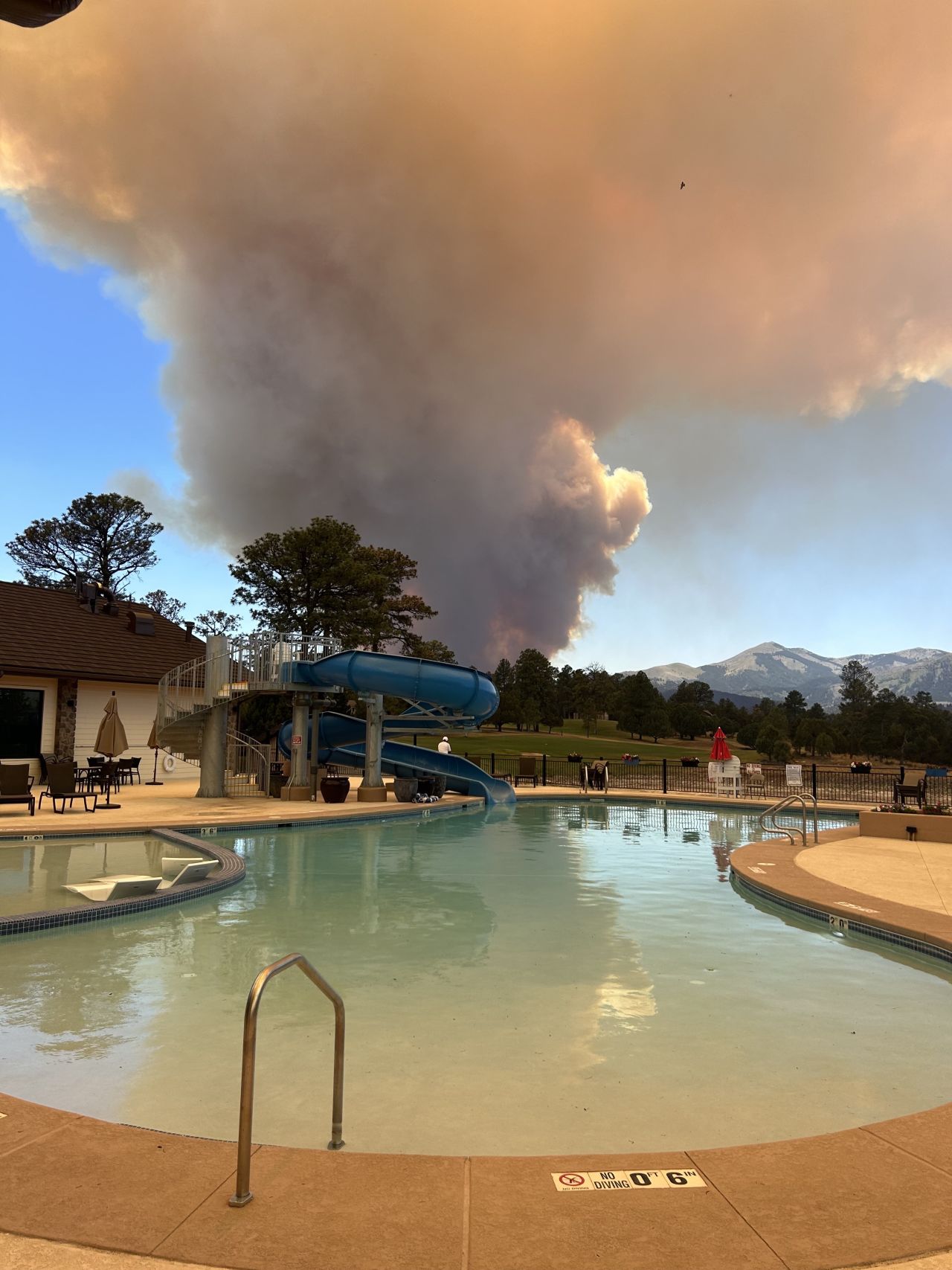 Kay Bymark said she noticed a “huge, billowing gray cloud” above her country club’s pool on Monday.