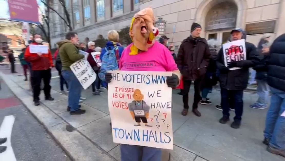 Joyce Meder protests near Sen. John Fetterman's office in Philadelphia.