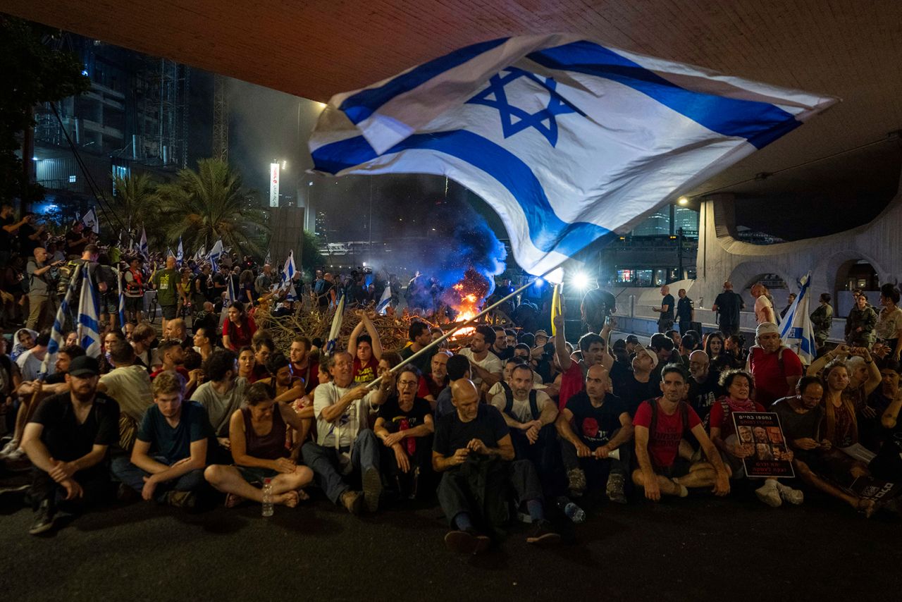 People block a road as they protest, calling for a deal for the immediate release of hostages held in the Gaza Strip by Hamas, in Tel Aviv, Israel, Sunday, September 1.