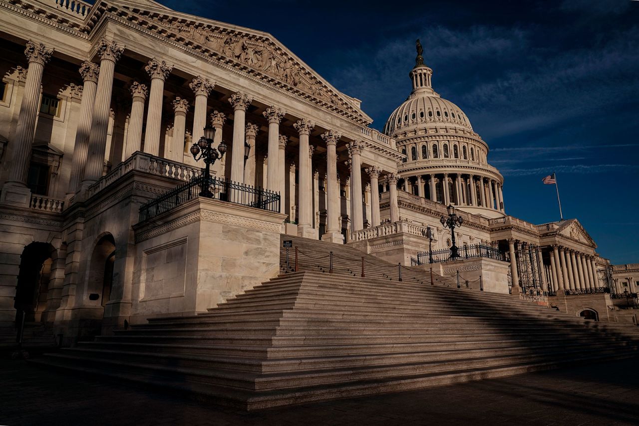 An American flag flies above the US Capitol on Tuesday. 