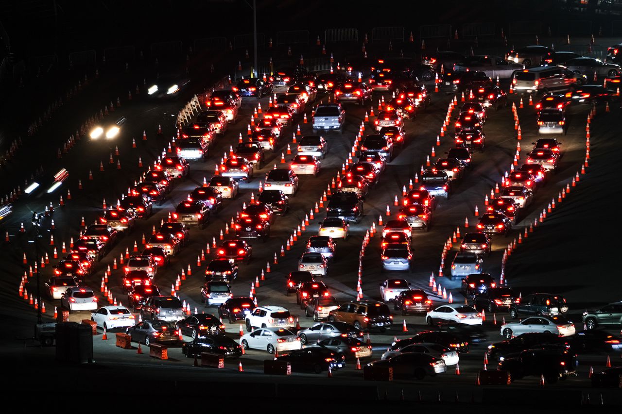 Motorists line up to take a coronavirus test in a parking lot at Dodger Stadium on Monday, January 4, in Los Angeles.