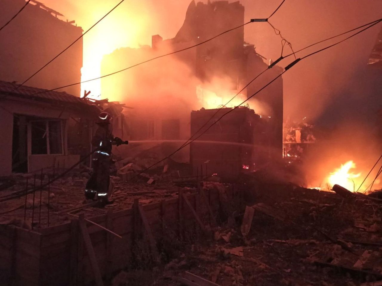 A firefighter works at a site of a hotel building hit by a Russian missile strike in the?Odesa?region on Wednesday.