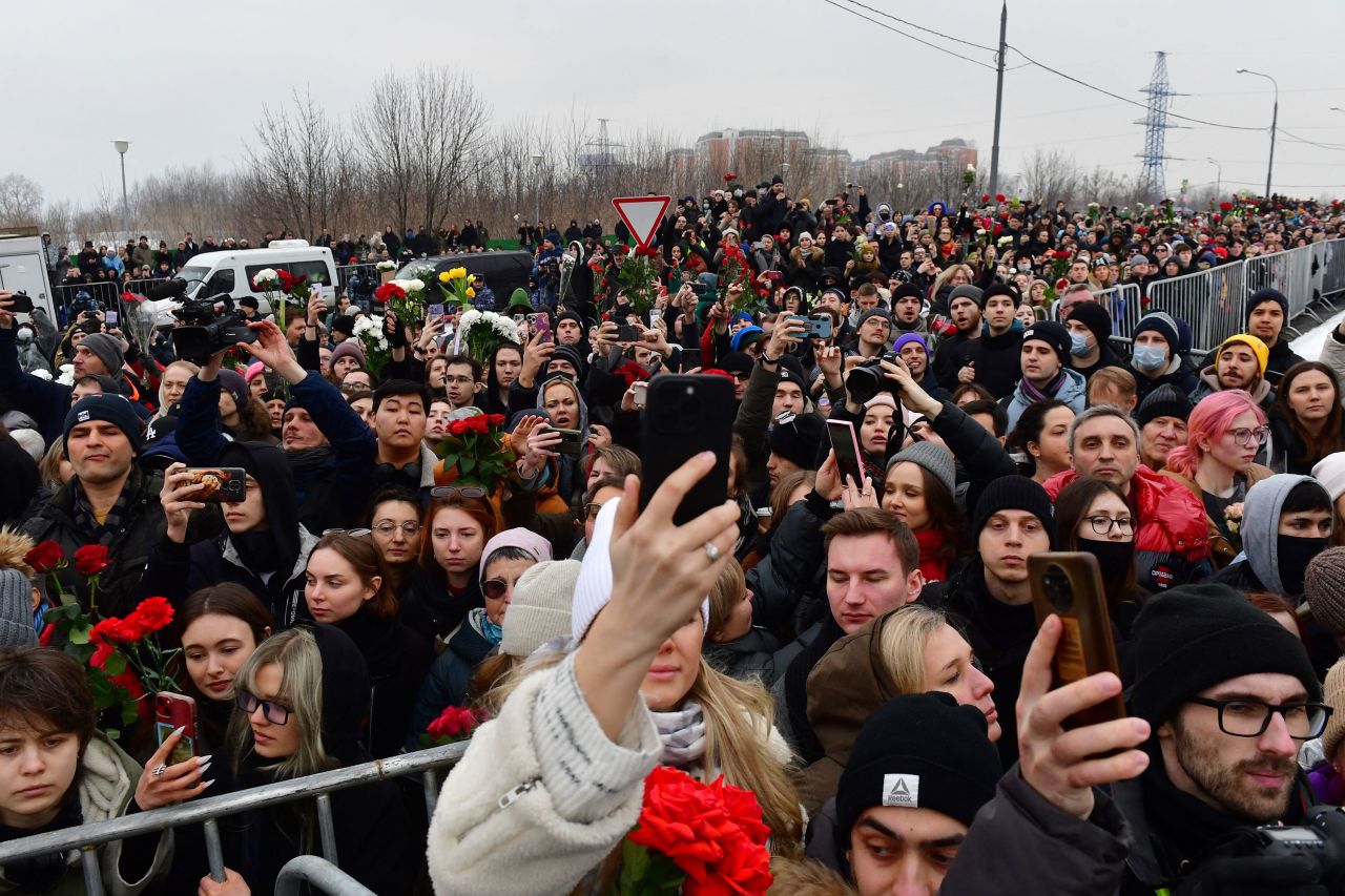 Mourners stand outside Borisovsky cemetery in Moscow as Alexey Navalny is laid to rest on Friday.