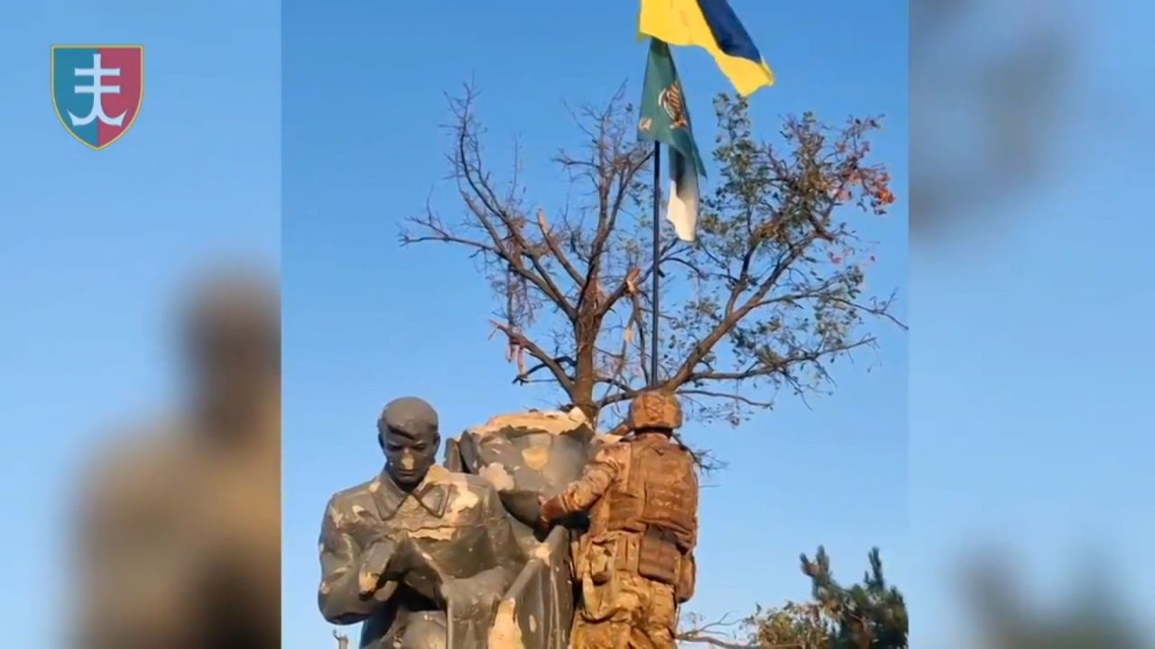 This screengrab from footage released by Kyiv’s forces shows soldiers raising the Ukrainian flag in Urozhaine, Ukraine.