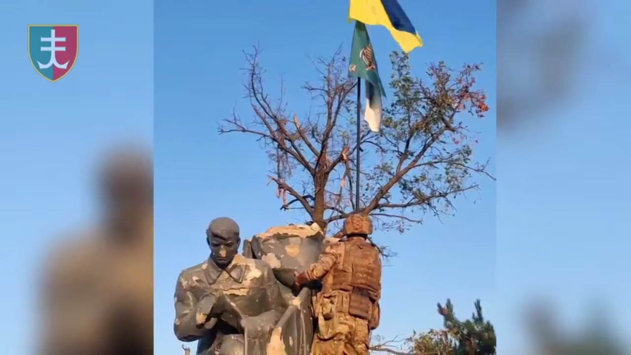 This screengrab from footage released by Kyiv’s forces shows soldiers raising the Ukrainian flag in Urozhaine, Ukraine.