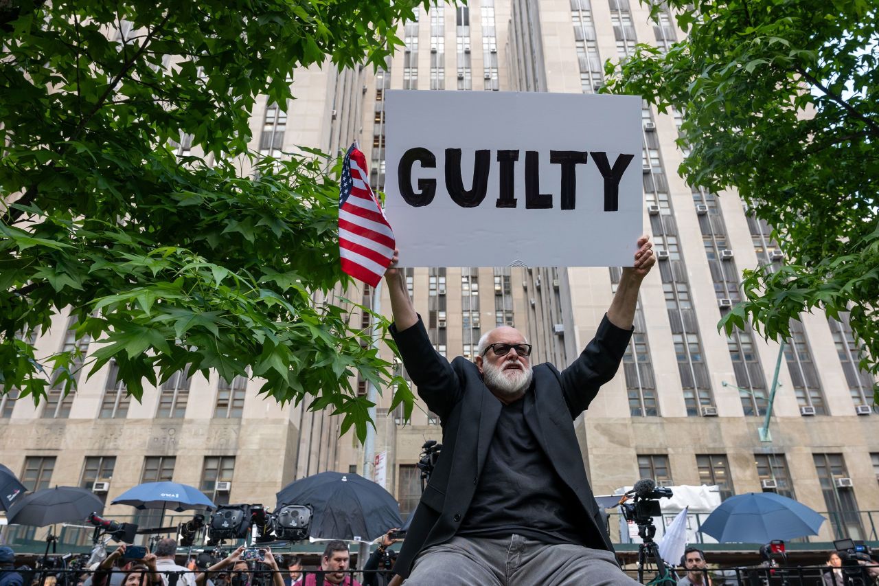 People celebrate after former President Donald Trump was found guilty on all counts at Manhattan Criminal Court on May 30 in New York City. 