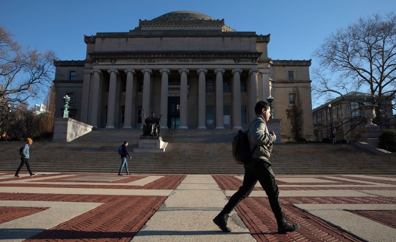 People walk around the Columbia University campus in New York on March 9.