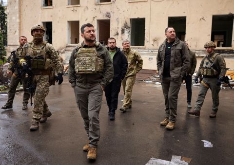 In this photo provided by the Ukrainian Presidential Press Office on Sunday, May 29, 2022, Ukrainian President Volodymyr Zelenskyy walks with his staff as he visits the war-hit Kharkiv region. 