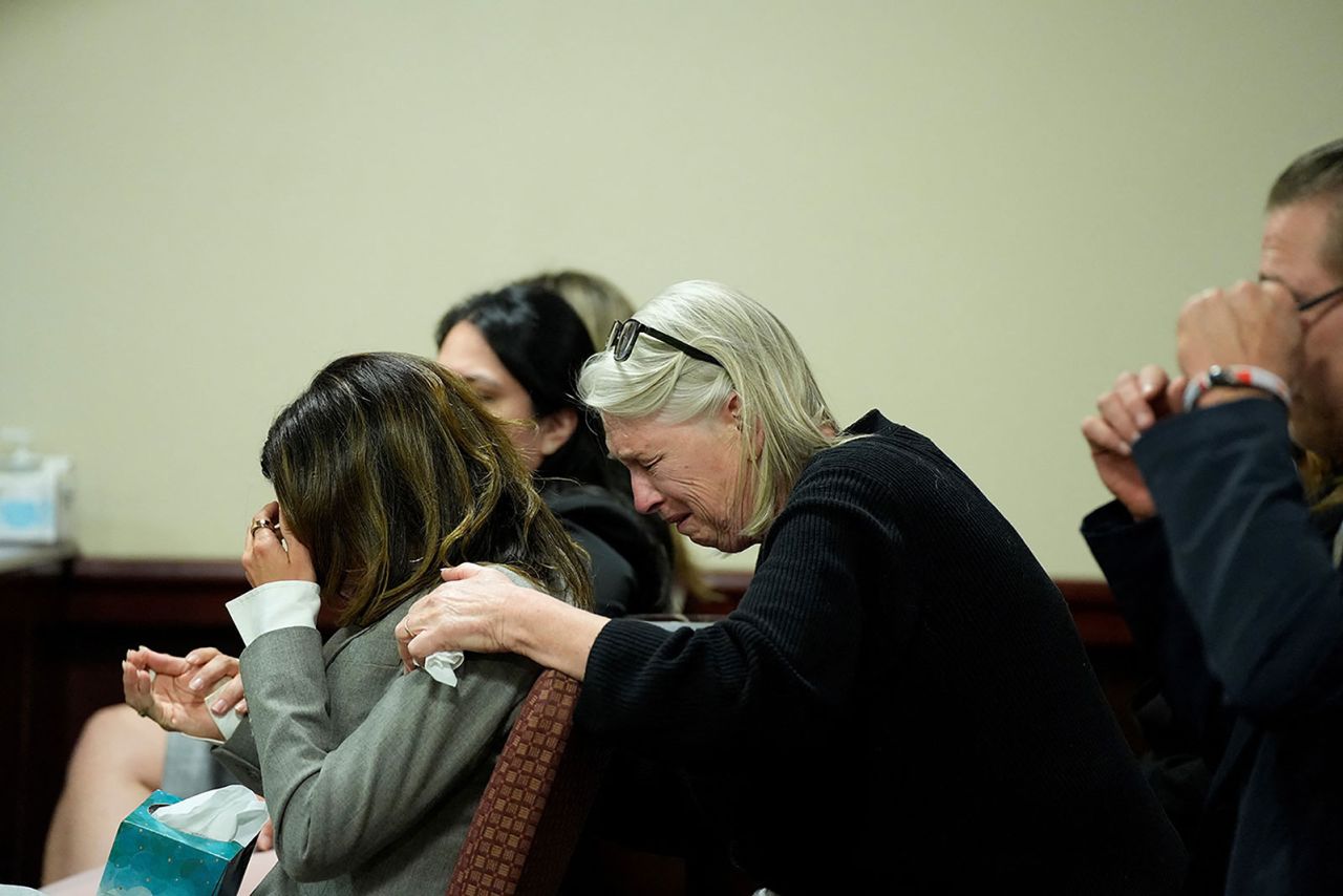 Hilaria Baldwin, left, wife of actor Alec Baldwin, and his sister Elizabeth Keuchler react during his trial.