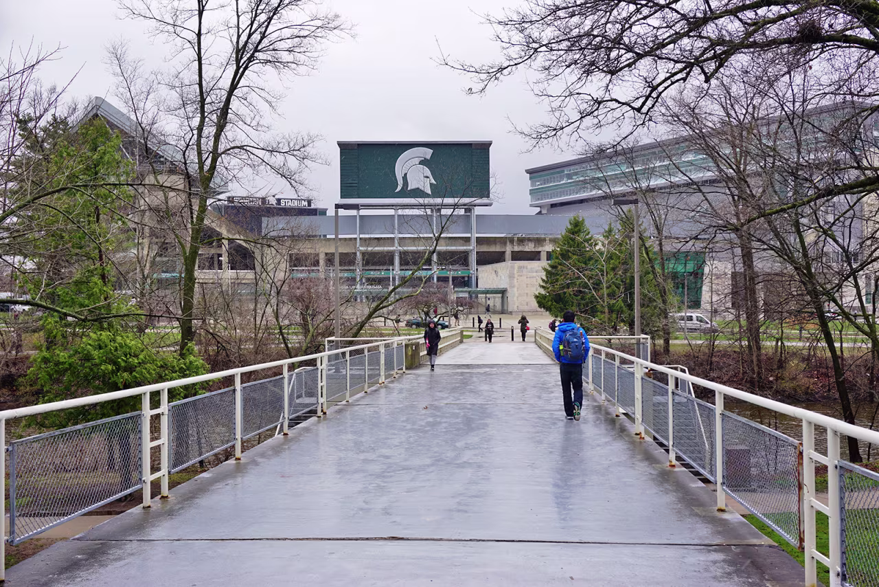 In this April 7, 2016 file photo, students walk on campus at Michigan State University in East Lansing, Michigan.