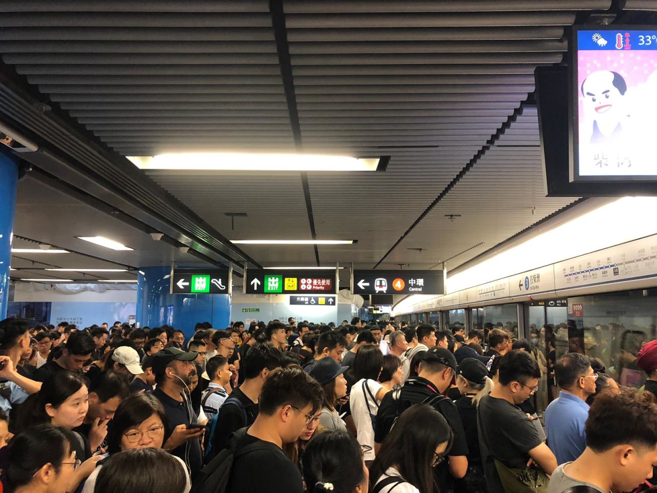 People packed into a subway station in Hong Kong, heading east to Victoria Park.