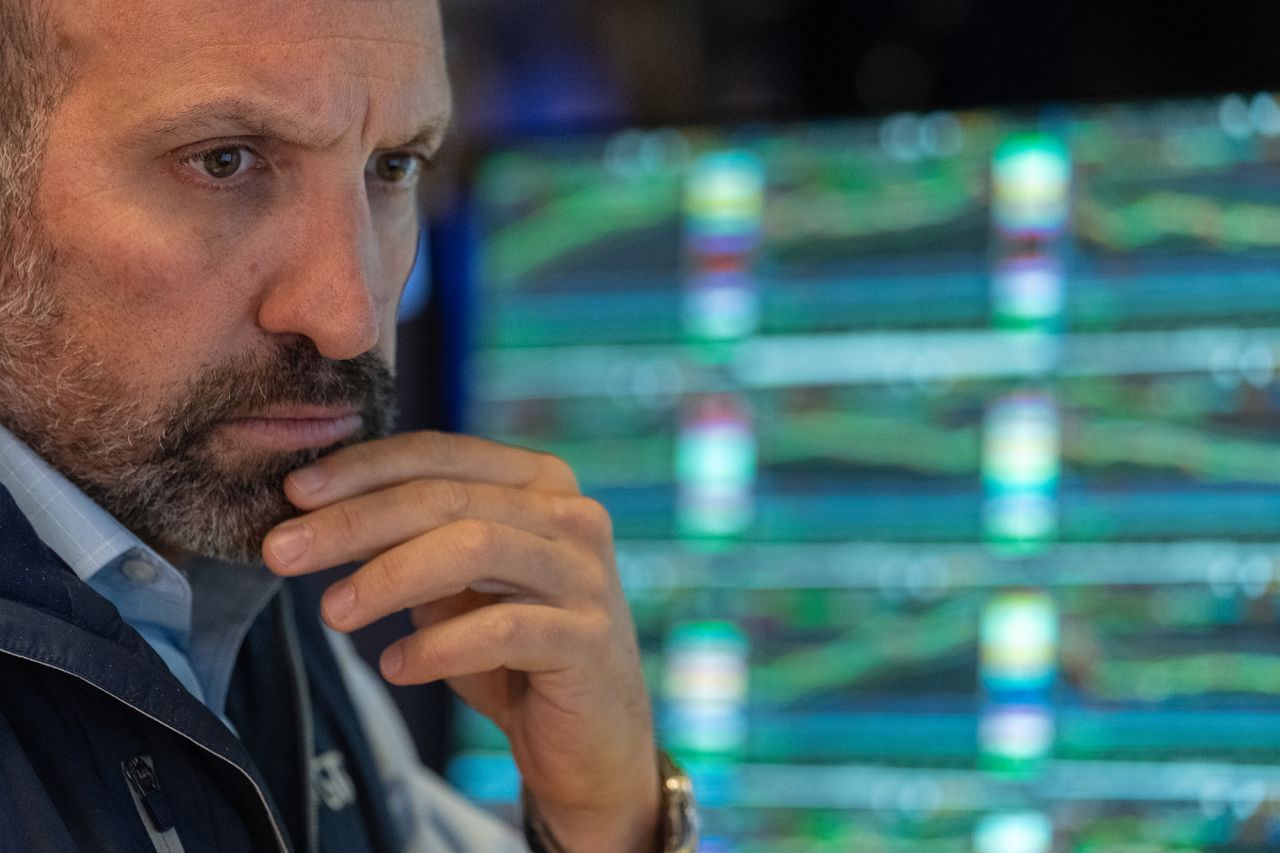 A trader works on the floor of the New York Stock Exchange on August 1.