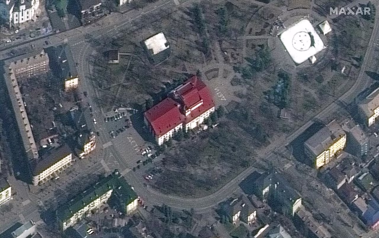 The Russian word ДЕТИ, or "Children" is seen on the grounds of the Mariupol theater prior to being bombed. 