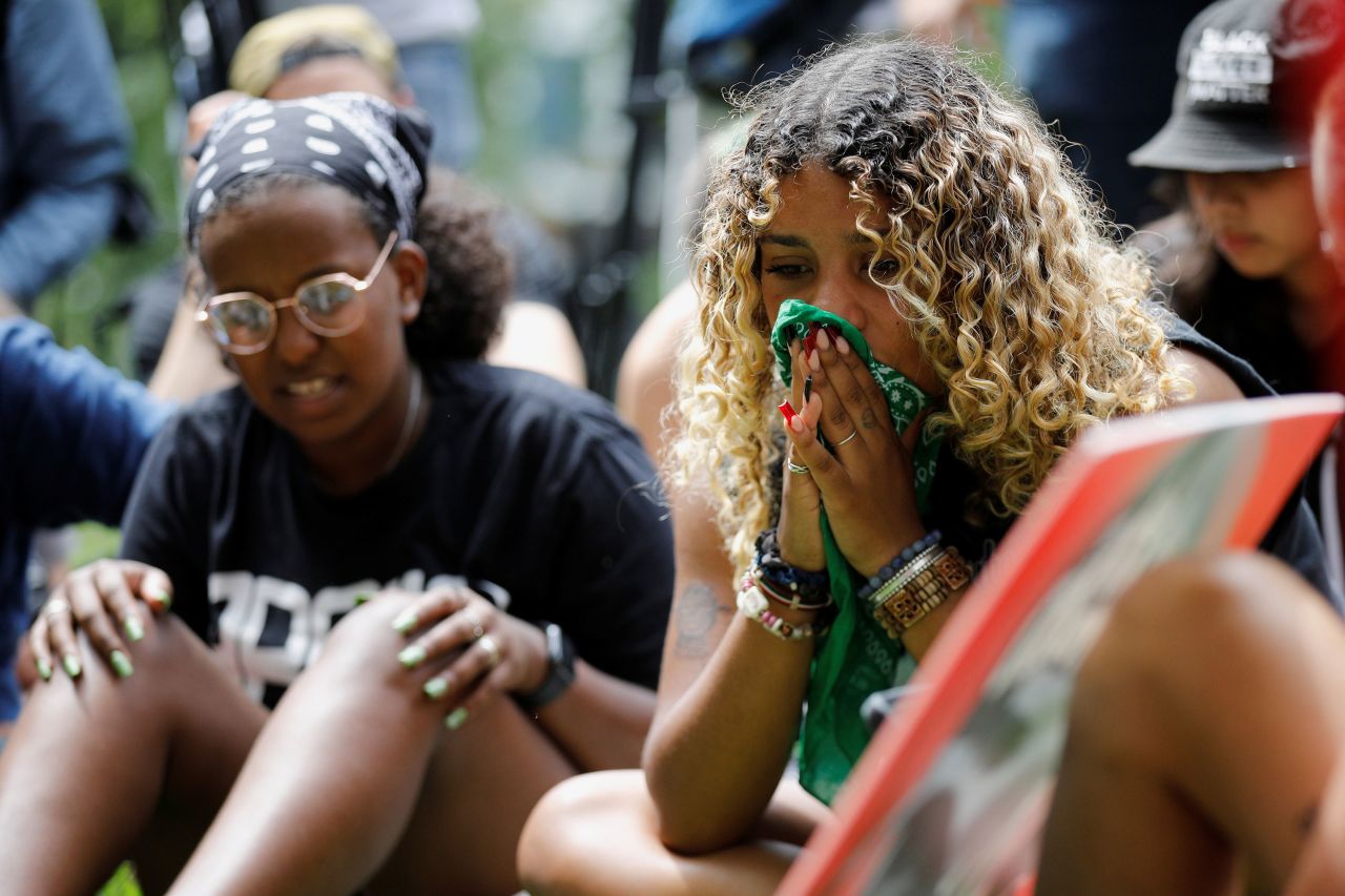 People wait outside Hennepin County Government Center ahead of the sentencing on June 25.