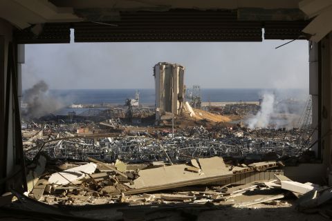 Smoke rises above damaged buildings at Beirut's port on August 5.