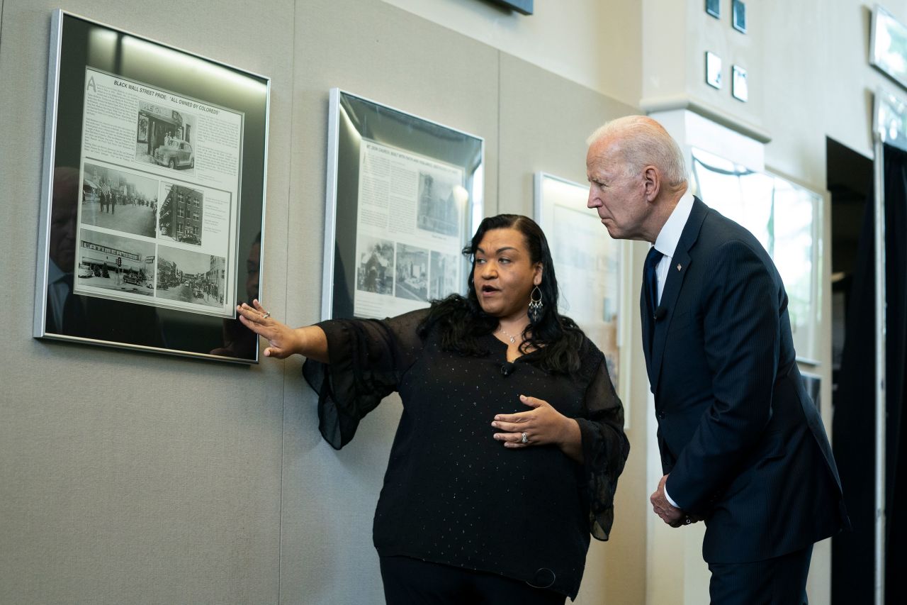 Michelle Brown-Burdex, program coordinator of the Greenwood Cultural Center, speaks as she leads President Joe Biden on a tour of the Greenwood Cultural Center in Tulsa, Oklahoma, on June 1.