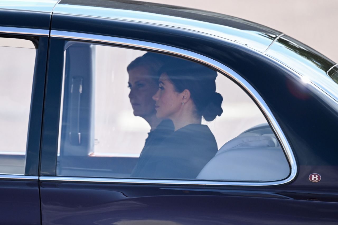 Sophie, Countess of Wessex and Meghan, Duchess of Sussex are driven in a car during the procession.