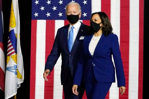 Democratic presidential candidate former Vice President Joe Biden and his running mate Senator Kamala Harris arrive to speak at a news conference at Alexis Dupont High School in Wilmington, Delaware, on August 12.