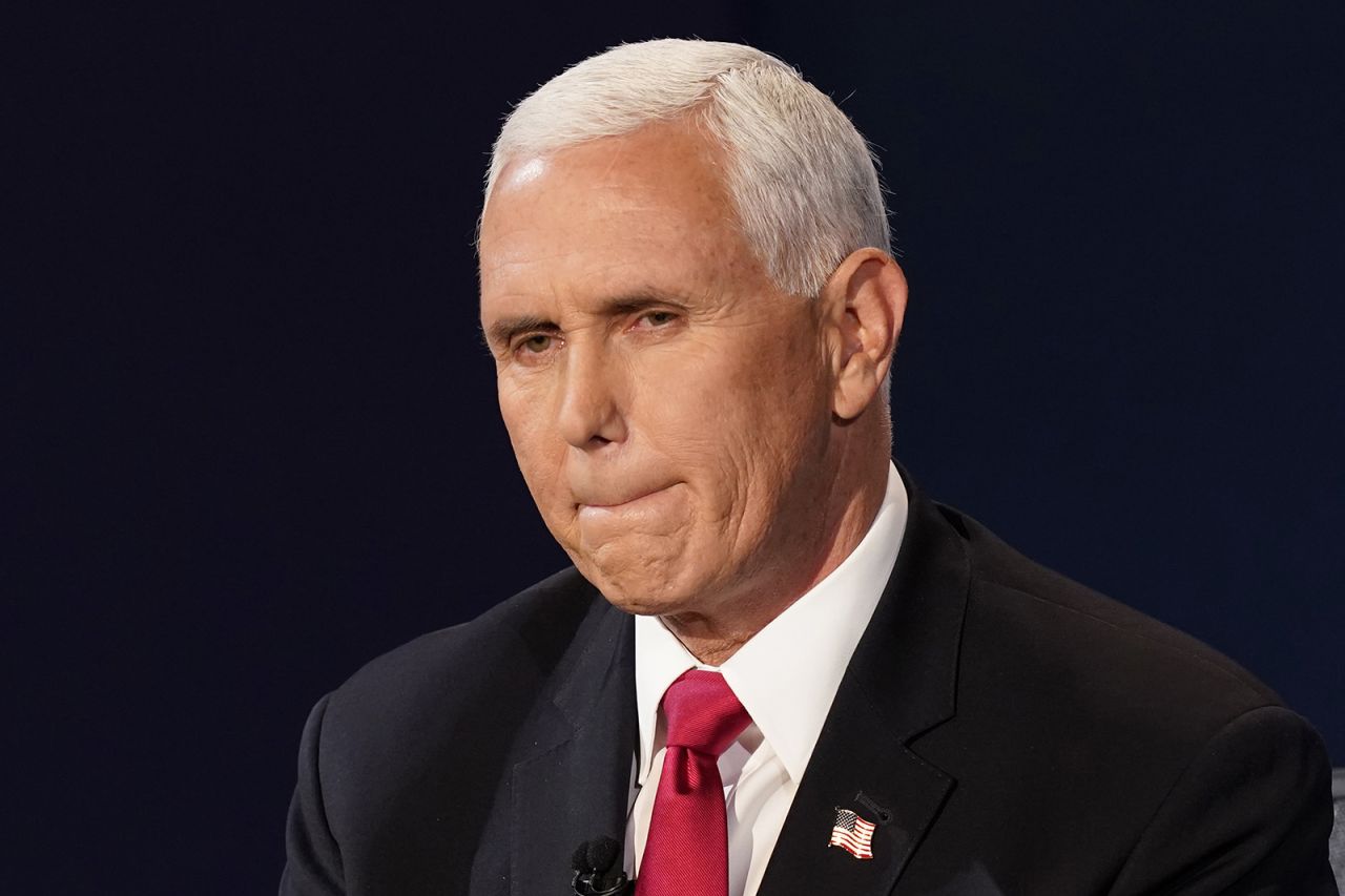 Vice President Mike Pence listens to Democratic vice presidential candidate Sen. Kamala Harris during the vice presidential debate in Salt Lake City on Wednesday. 