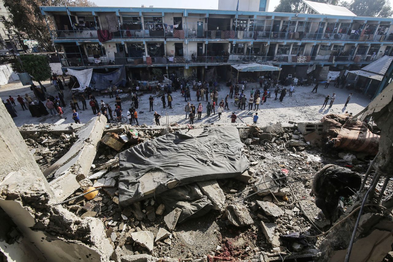 Palestinians inspect damage after an Israeli airstrike on a United Nations-run school in Deir El-Balah, Gaza, on June 6. 