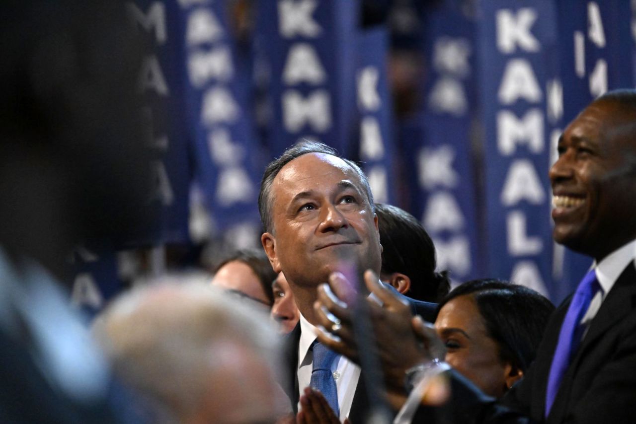 Harris' husband, Doug Emhoff, watches his wife take the stage at the 2024 Democratic National Convention on Thursday in Chicago.