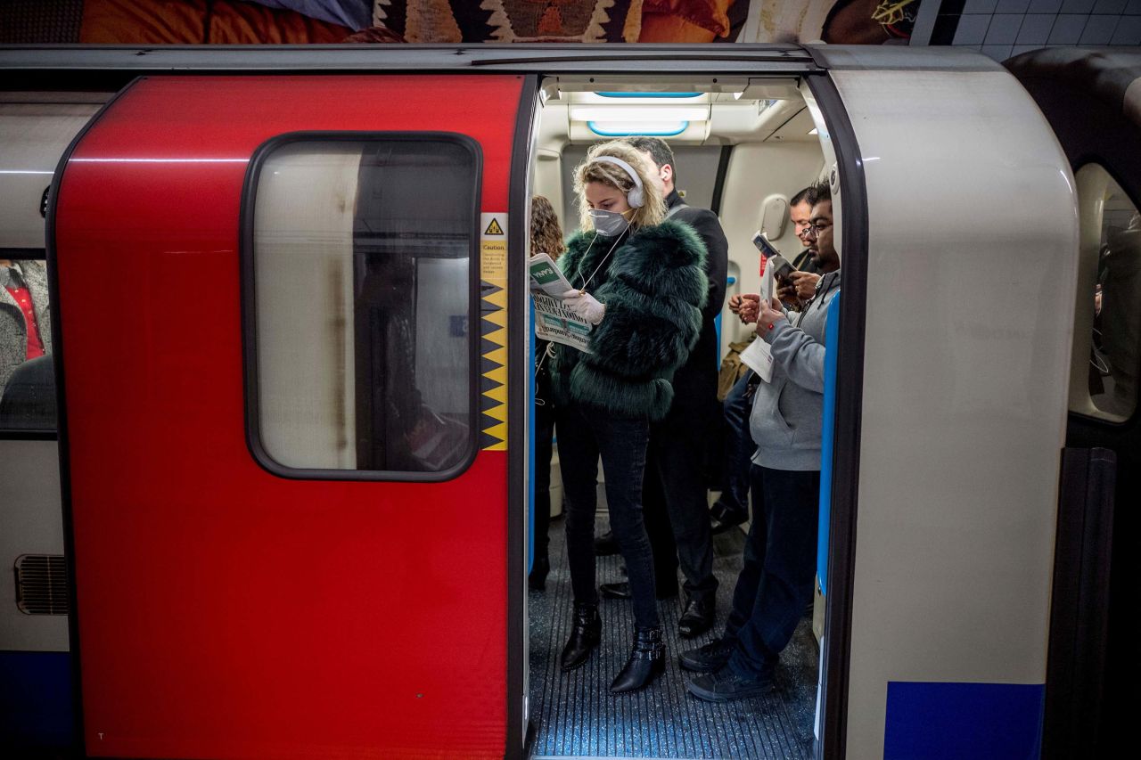 Commuters travel on a London Underground train on March 18.