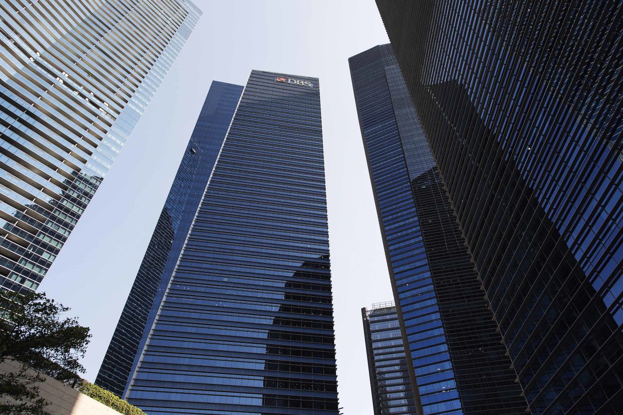 A DBS bank logo is displayed atop the Marina Bay Financial Center in Singapore in August 2017.