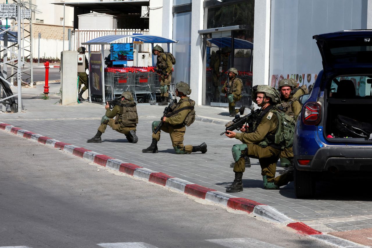 Israeli soldiers work to secure residential areas following a mass-infiltration by Hamas gunmen in Sderot, southern?Israel, on?October 7.