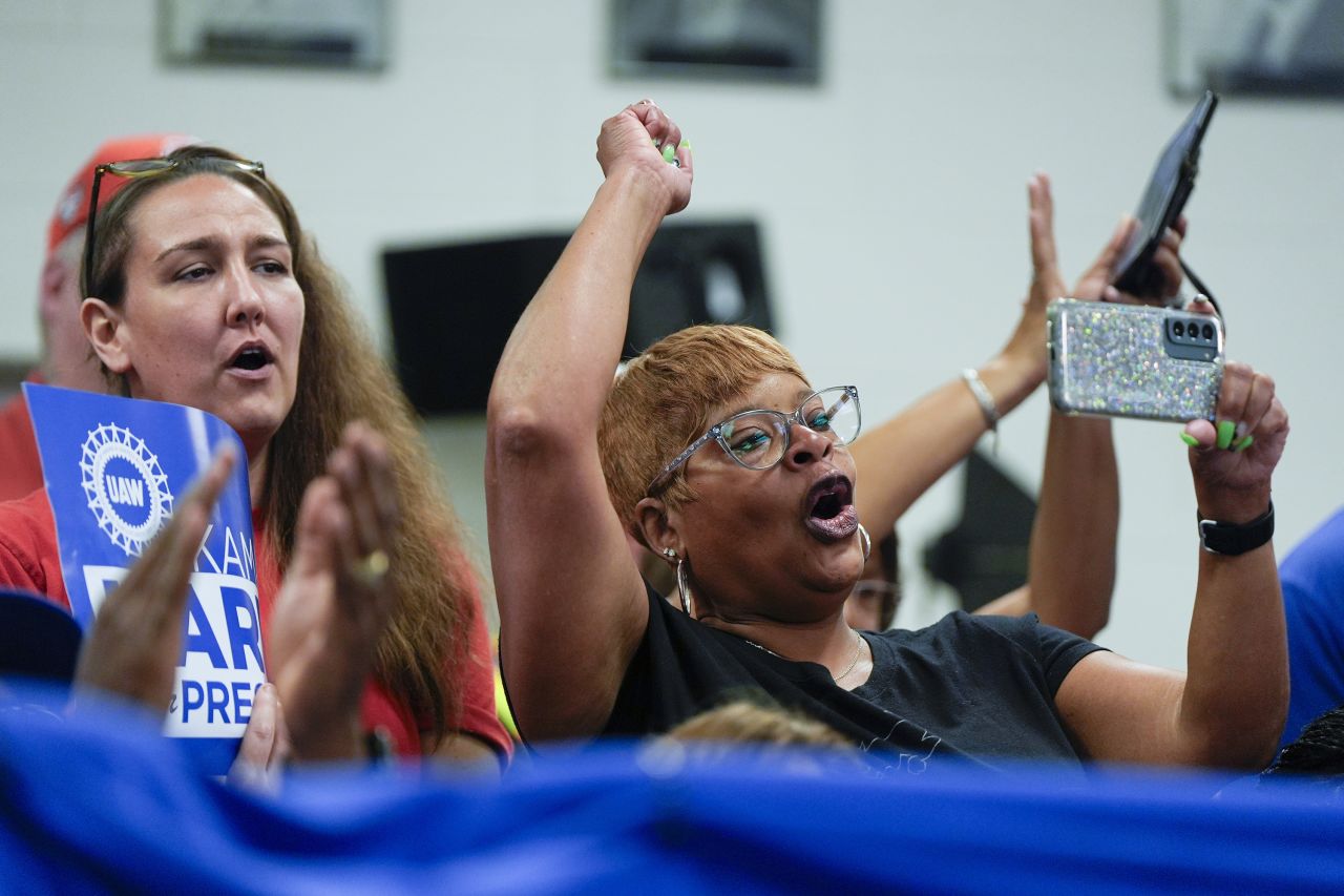 Union members listen as Vice President Kamala Harris and Minnesota Gov. Tim Walz, Democratic vice presidential nominee, speak at a campaign rally at United Auto Workers Local 900, on August 8, in Wayne, Michigan.