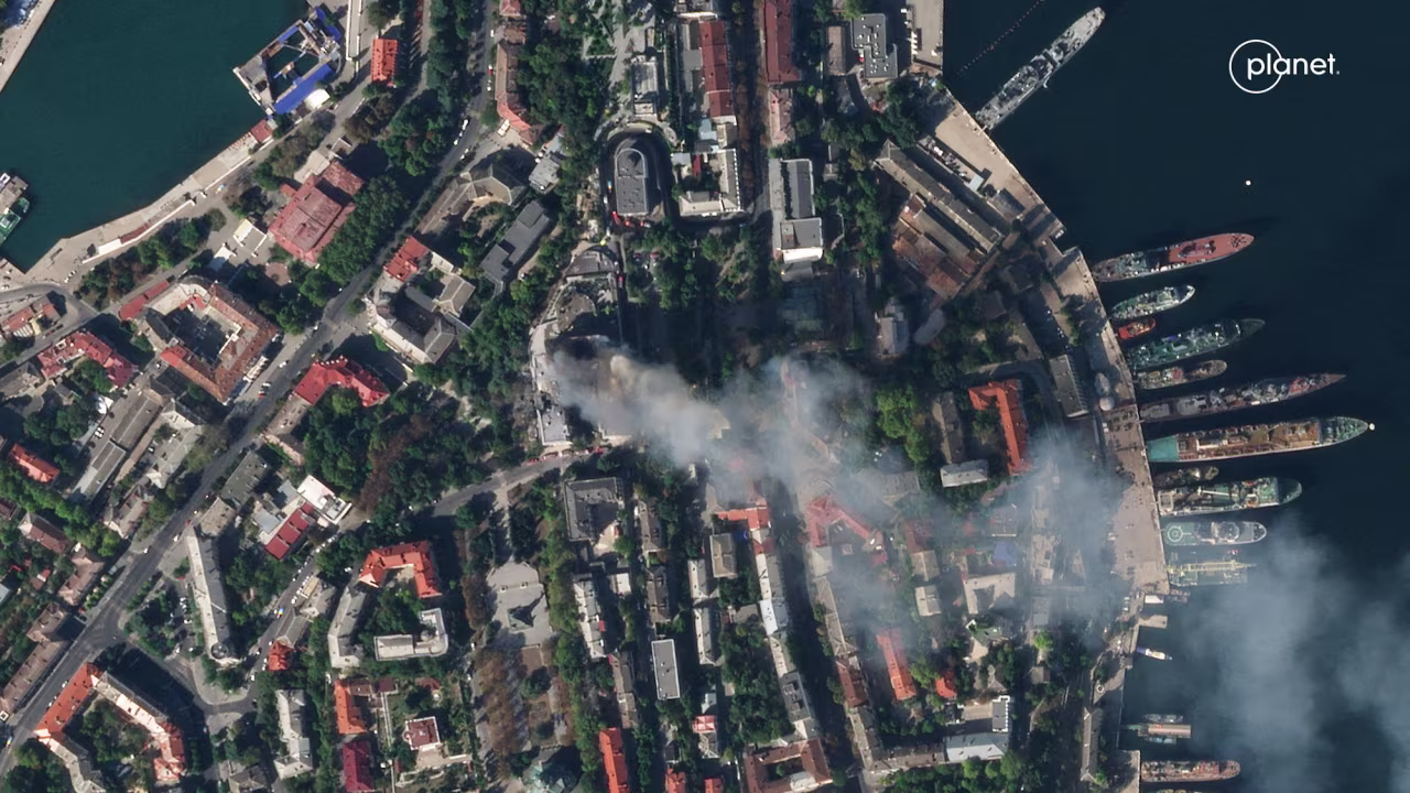 A satellite image shows smoke billowing from the Russian Black Sea Navy HQ after a missile strike in Sevastopol on Friday.