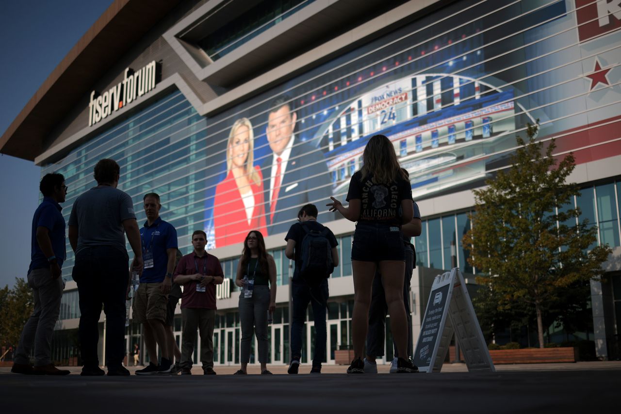 Volunteers gather outside the Fiserv Forum on Wednesday, August 23.