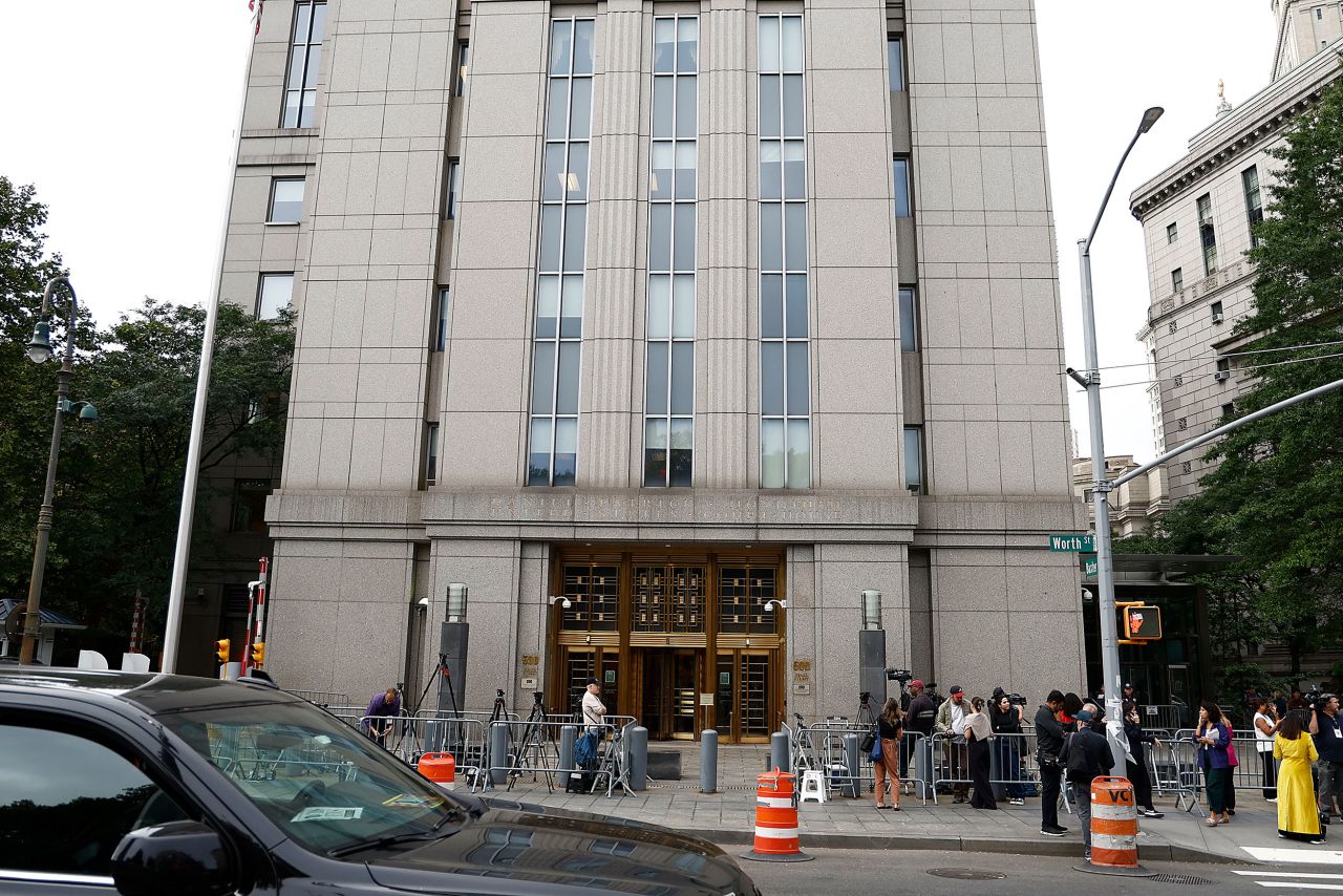 Members of the media wait outside Daniel Patrick Moynihan United States Courthouse on September 17 in New York.