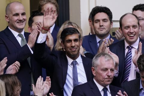 Rishi Sunak (C) waves after winning the Conservative Party leadership contest at the Conservative party Headquarters in London, on October 24.