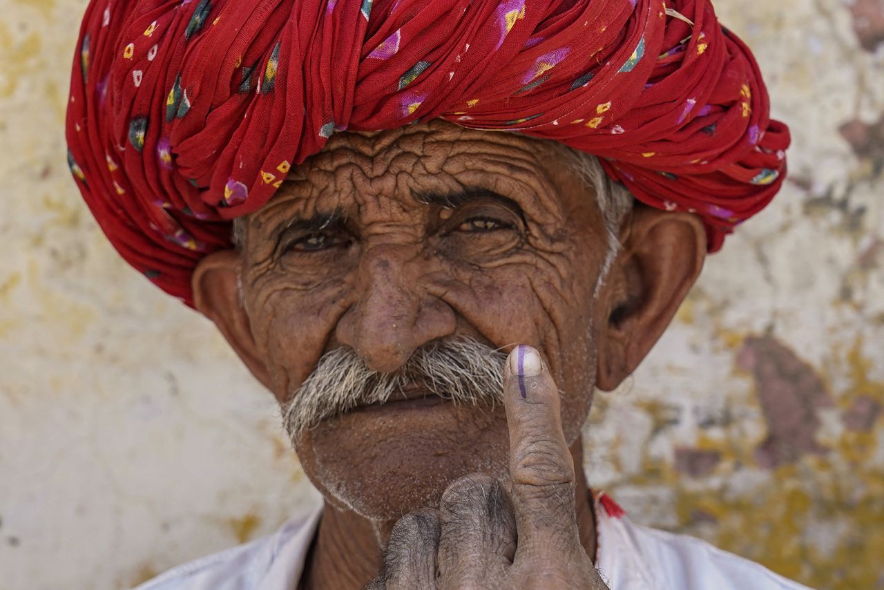 A man shows his inked finger after casting his ballot at a polling station during the second phase of voting in India's general elections, in Ajmer on April 26.