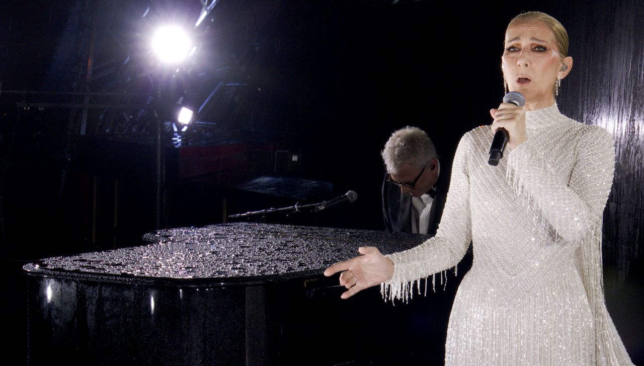 A screengrab from the Olympic Broadcasting Services shows Celine Dion performing on the Eiffel Tower tonight.