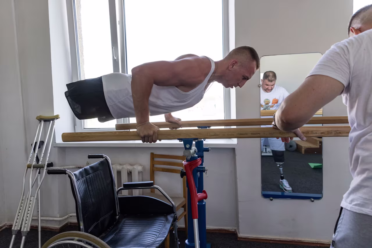Mykhailo “Misha” Varvarych exercises inside a gym at a hospital in Truskavets, Ukraine.